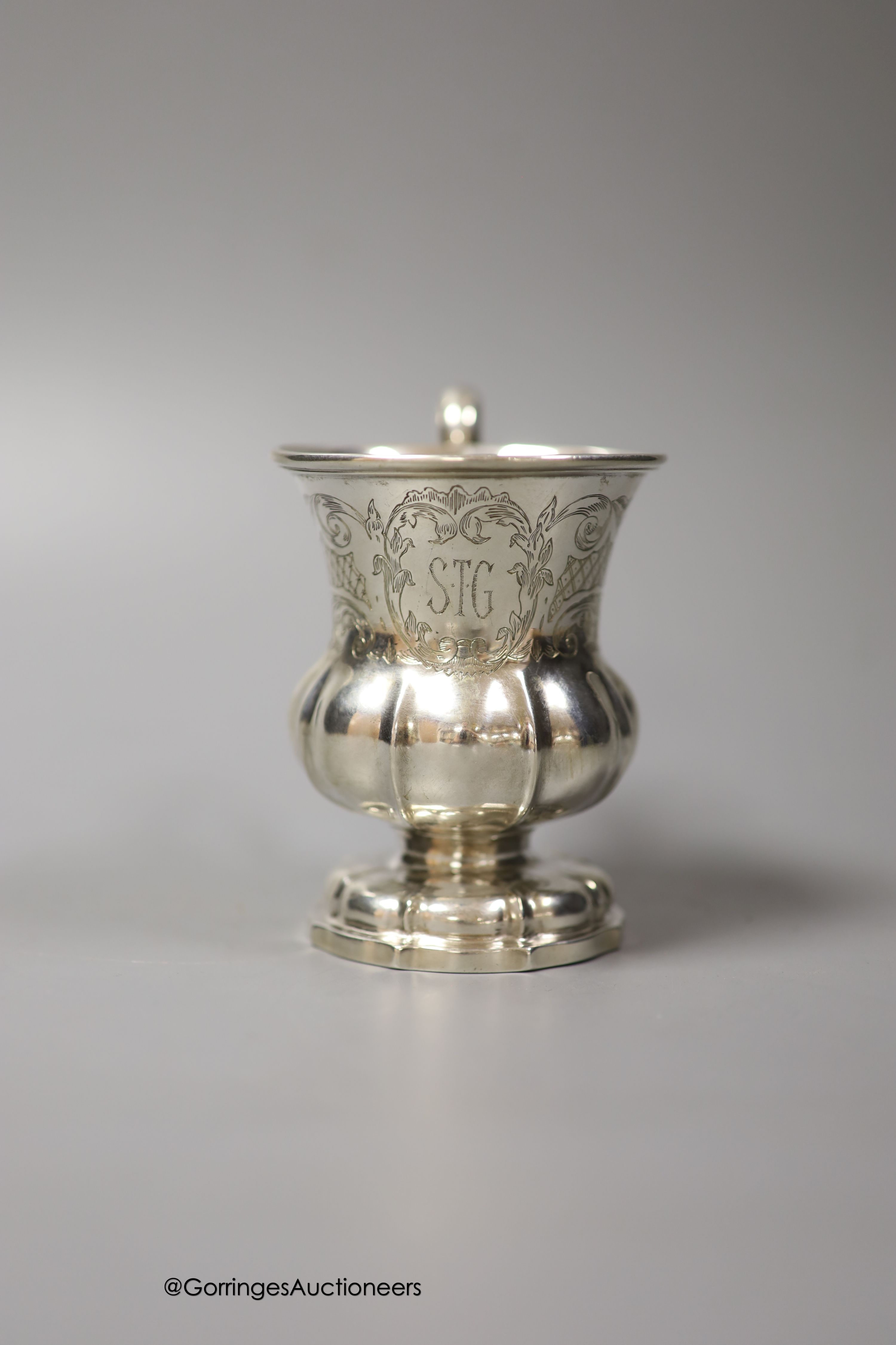 A mid 19th century Indian Colonial white metal vase shaped christening mug, by George Gordon & Co, Madras, (1821-1845) height 10.5cm, 5oz.